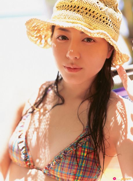 Asian Cutie Yumi Sugimoto Displays Her Big Juggs And Poses In A Bikini