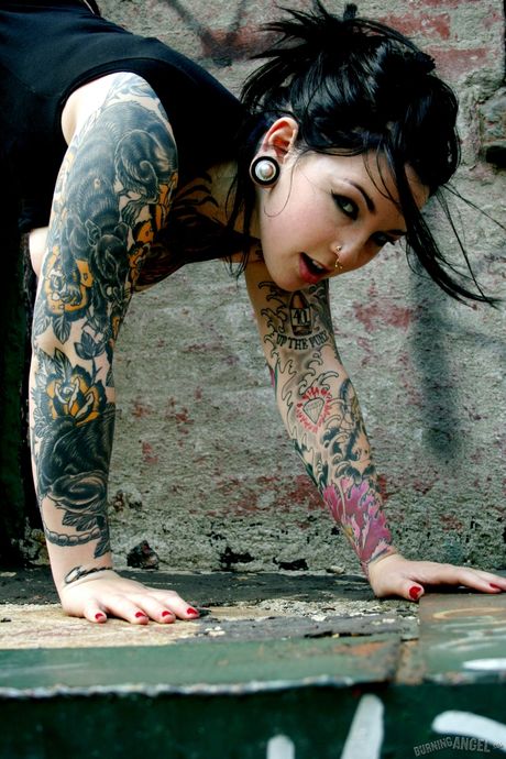 burning angel: Tat-Covered american brunette Adahlia Cole removes her dress and heels to pose naked