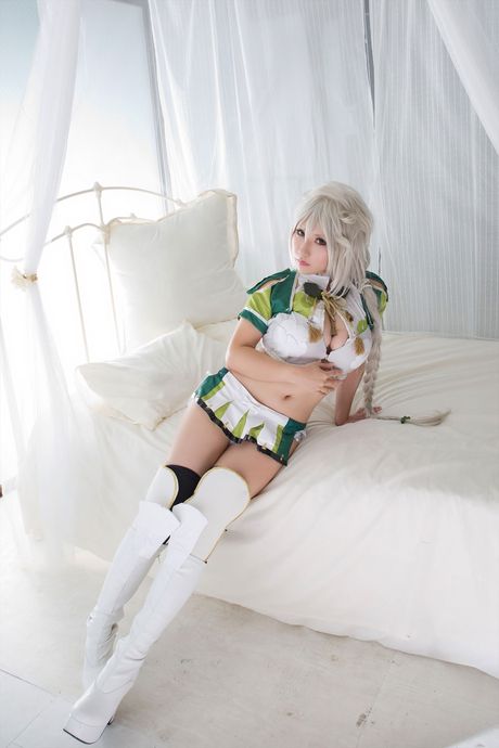 all gravure: Asian doll Saku sports short hair while modelling in a tank top and boots