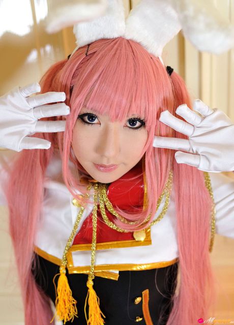 all gravure: Asian stunner Saku wears a pink wig and gloves while modelling in a hall