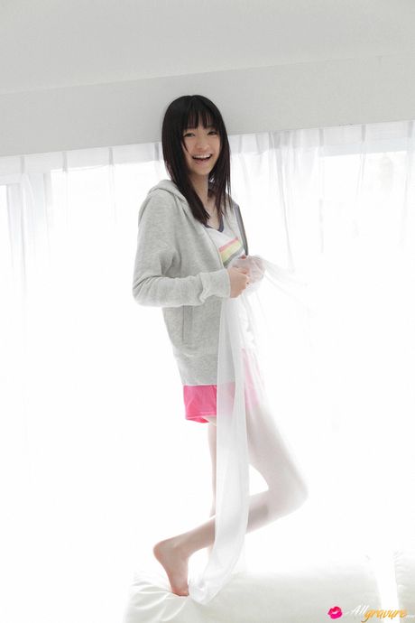 all gravure: Asian doll Rina Aizawa highlights her huge tits and disrobes for the modeling session in a solo