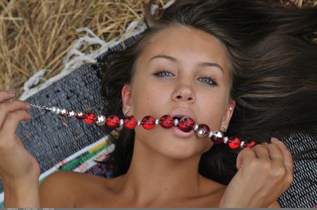 domai: Beautiful russian girl Katarina B takes off her clothes on a blanket in a field