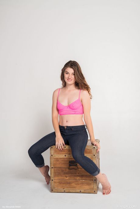 femjoy: Petite american doll Kassi gets completely naked on a rug with certainty