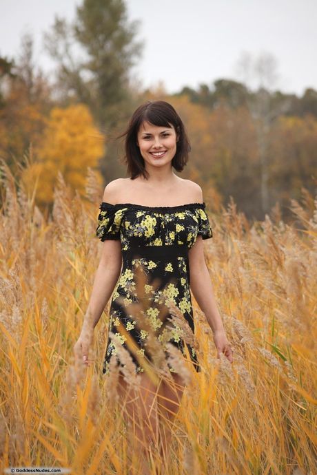 goddess nudes: Nice ukrainian beauty Emanuel A removes a black dress to pose nude in a field