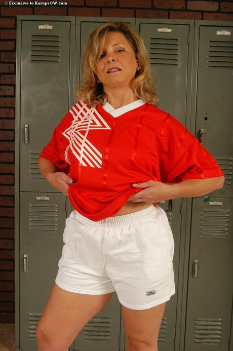 karups older women: Mature light-haired Katie strips to her socks in a kitchen before masturbating