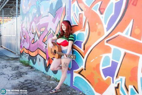 score land: Redhead american babe Harlow Nyx reveals her large boobs and poses with a guitar