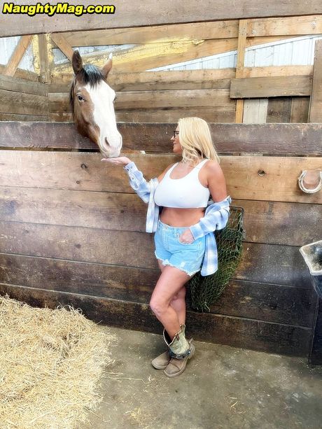 naughty mag: Blond american MILF Maddie Cross exhibits her big melons and fingers herself outdoors