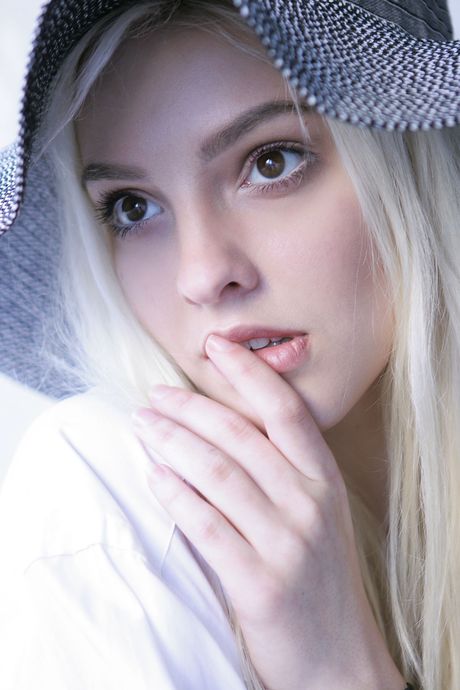 the life erotic: Blond ukrainian beauty Kira W gets naked in black stockings on a bed